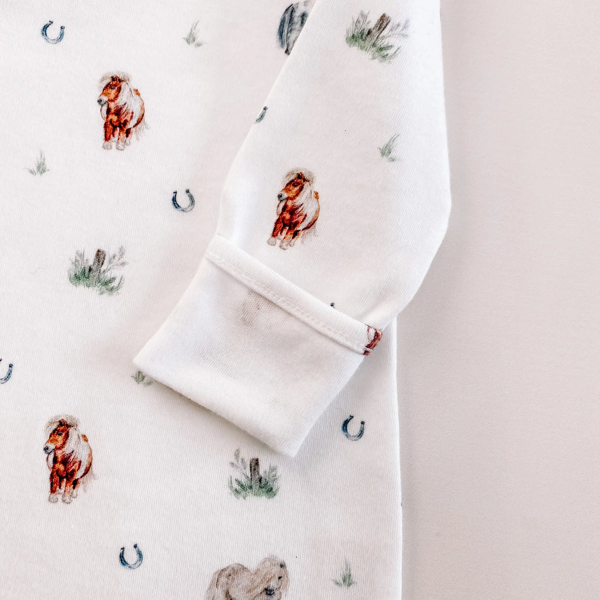 Pony print baby sleepsuit