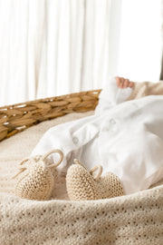 Bow knit newborn booties in gift bag
