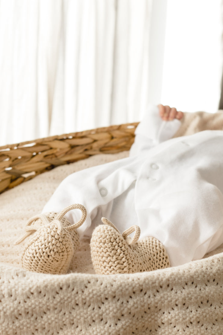 Bow knit newborn booties in gift bag