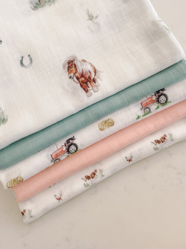 Pony print muslin swaddle blanket