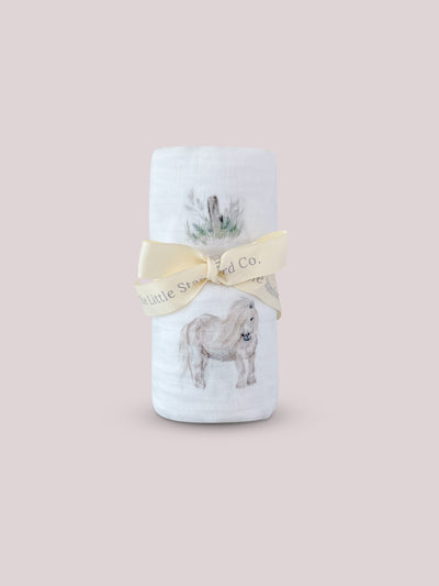 Pony print muslin swaddle blanket